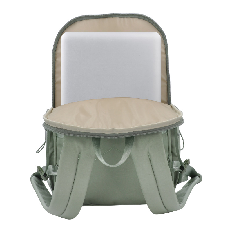 green backpack laptop travel